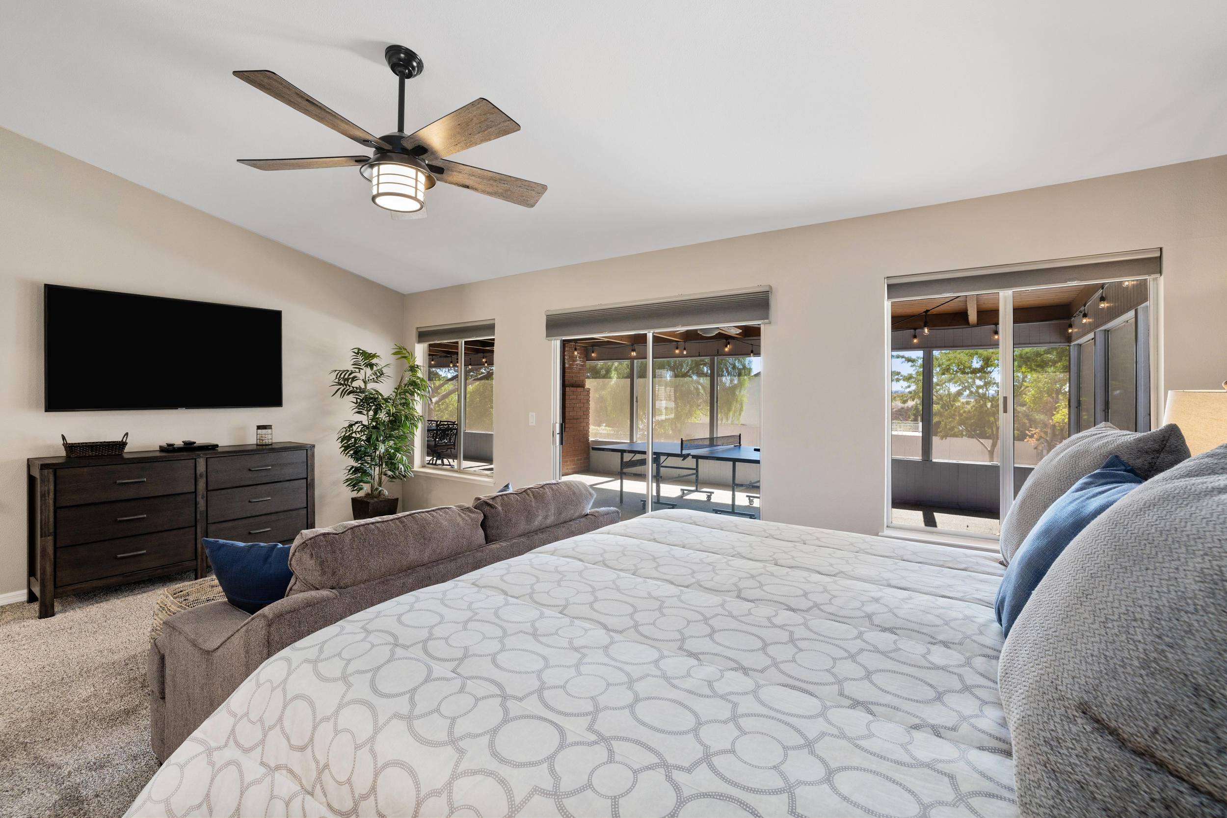 33727 Liberty Road Yucaipa, CA 92399 - Photo 13 of 39 a bedroom with a bed window and a flat screen tv