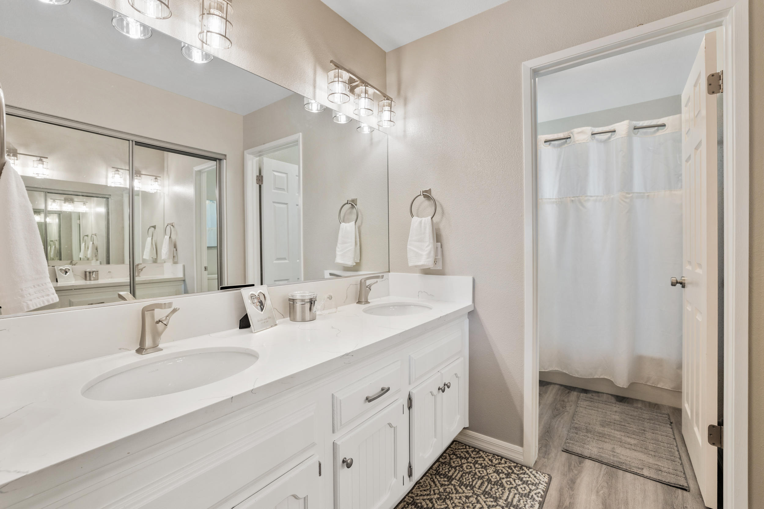 33727 Liberty Road Yucaipa, CA 92399 - Photo 15 of 39 a bathroom with double vanity sinks and a mirror