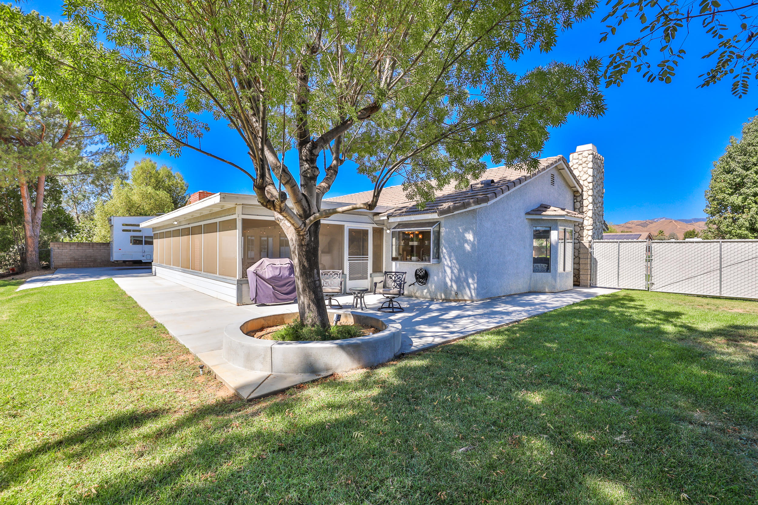 33727 Liberty Road Yucaipa, CA 92399 - Photo 28 of 39 a front view of a house with patio and garden
