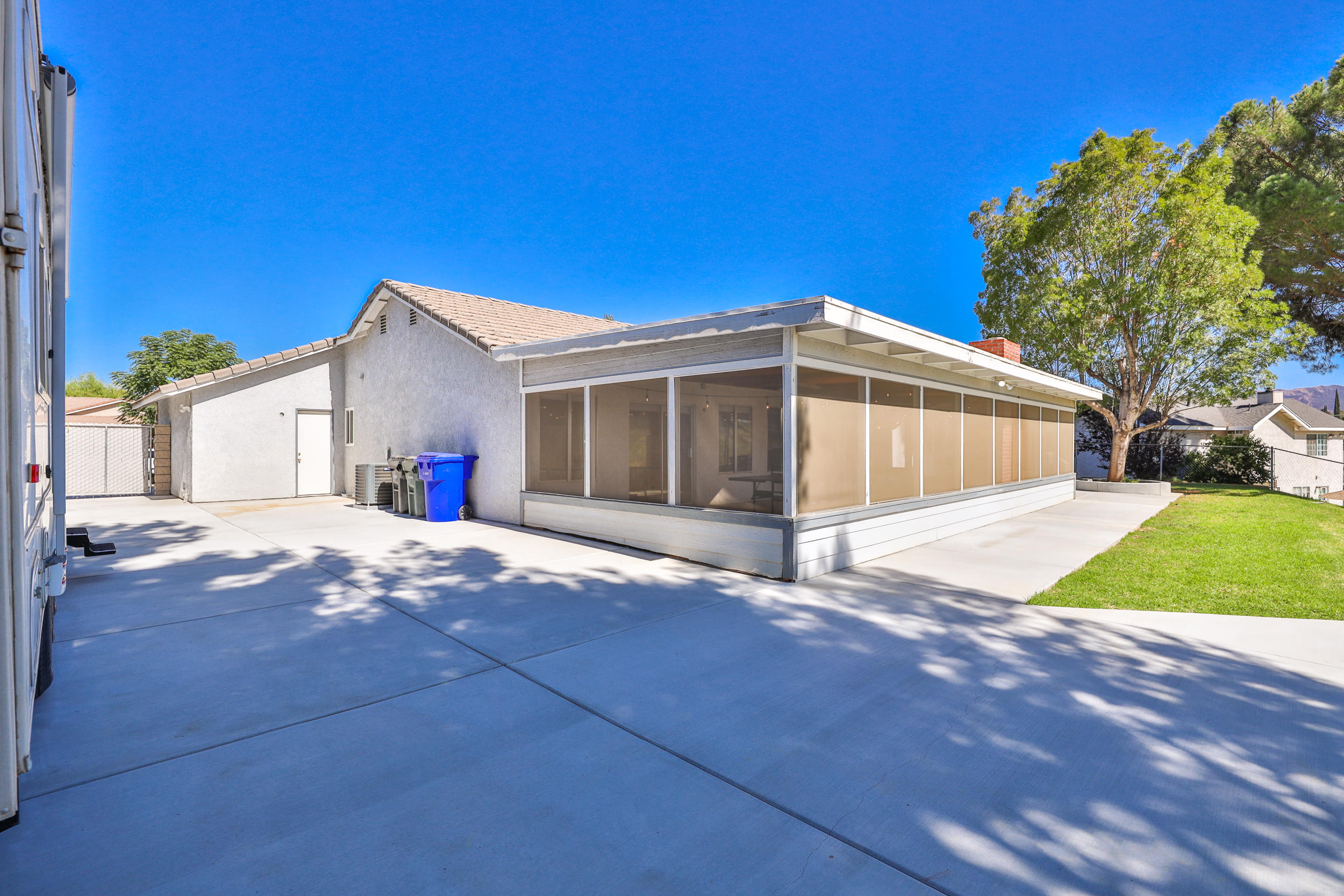 33727 Liberty Road Yucaipa, CA 92399 - Photo 30 of 39 a view of a house with a yard and a garage