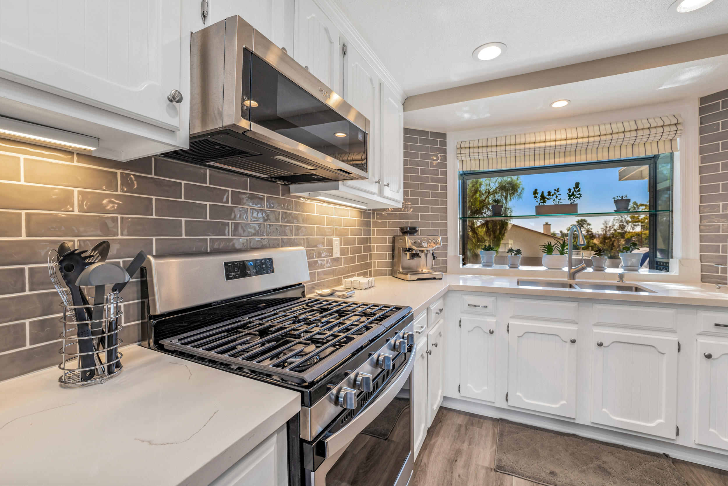 33727 Liberty Road Yucaipa, CA 92399 - Photo 10 of 39 a kitchen with kitchen island granite countertop a sink and a stove
