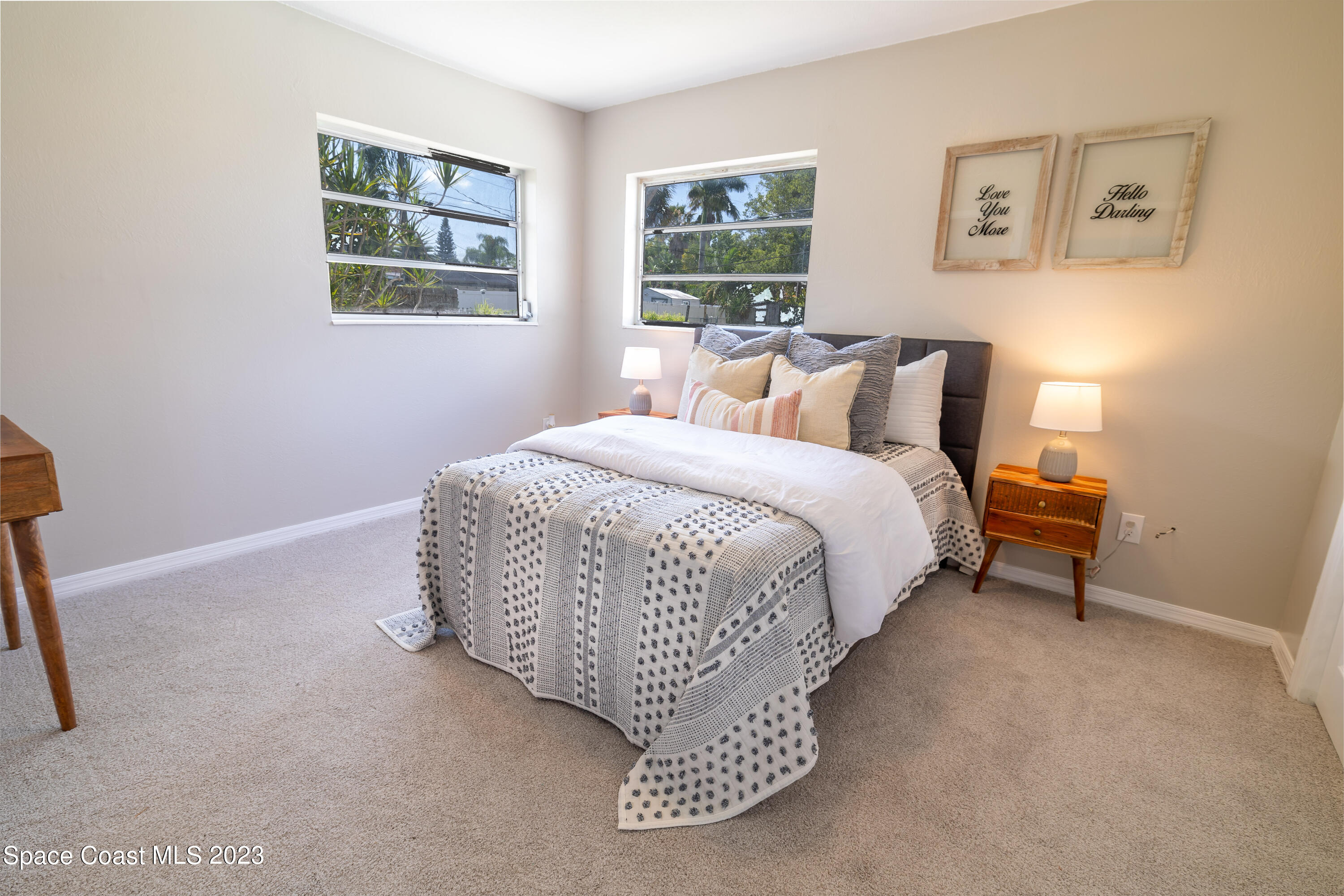 2411 Dairy Road Melbourne, FL 32901 - Photo 11 of 25 a bed room with a bed and a chair