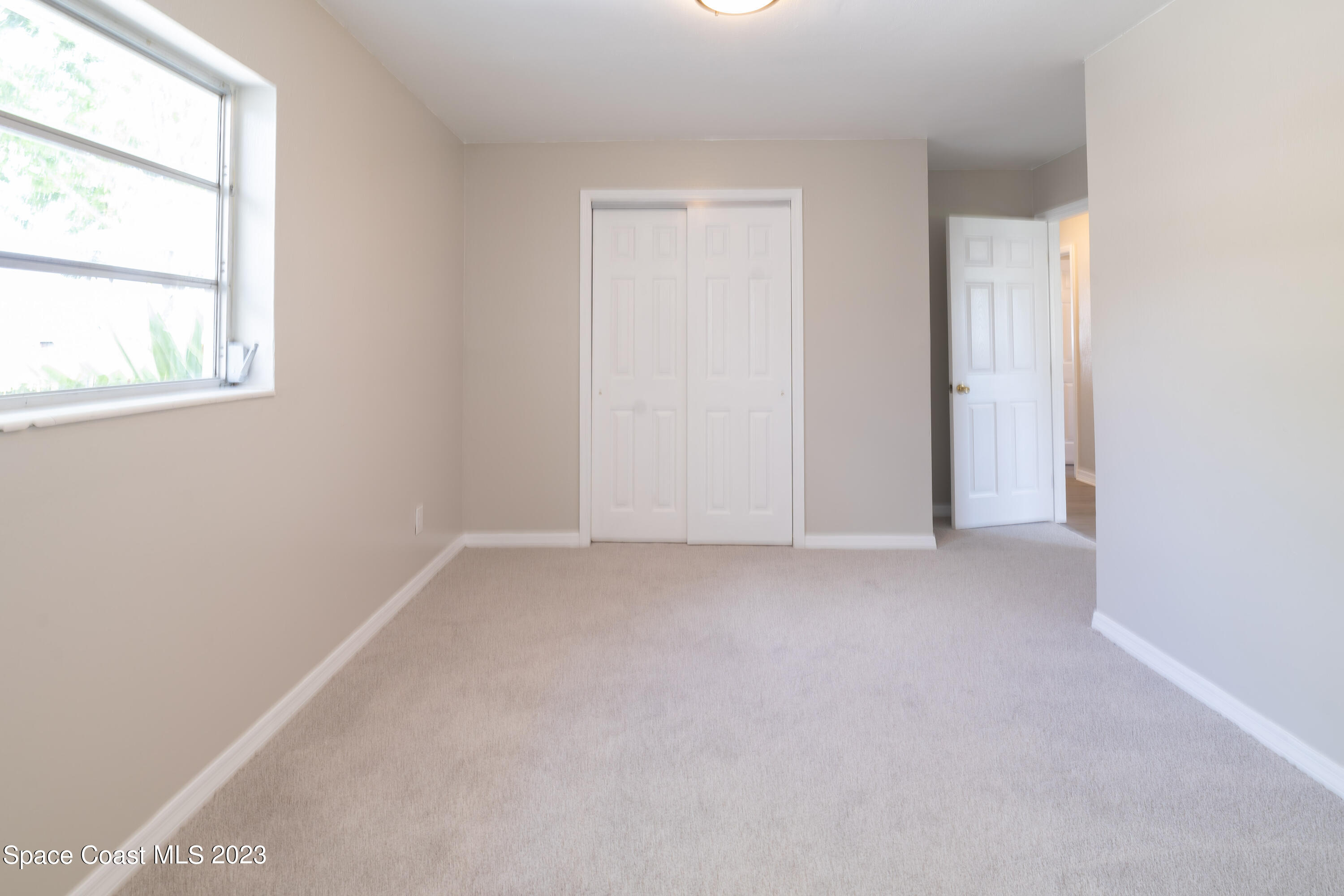 2411 Dairy Road Melbourne, FL 32901 - Photo 15 of 25 an empty room with a window
