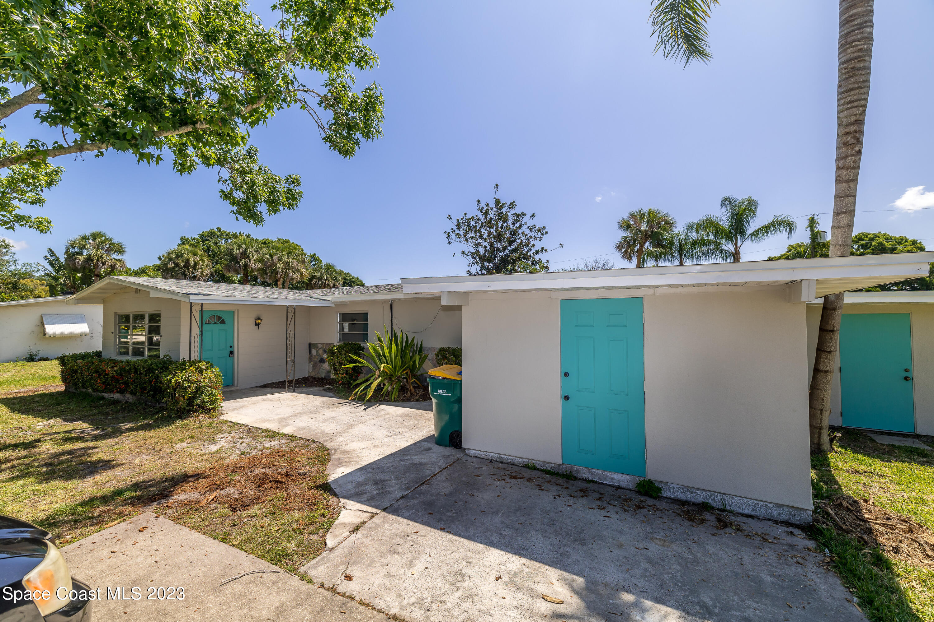 2411 Dairy Road Melbourne, FL 32901 - Photo 2 of 25 a front view of a house with a yard