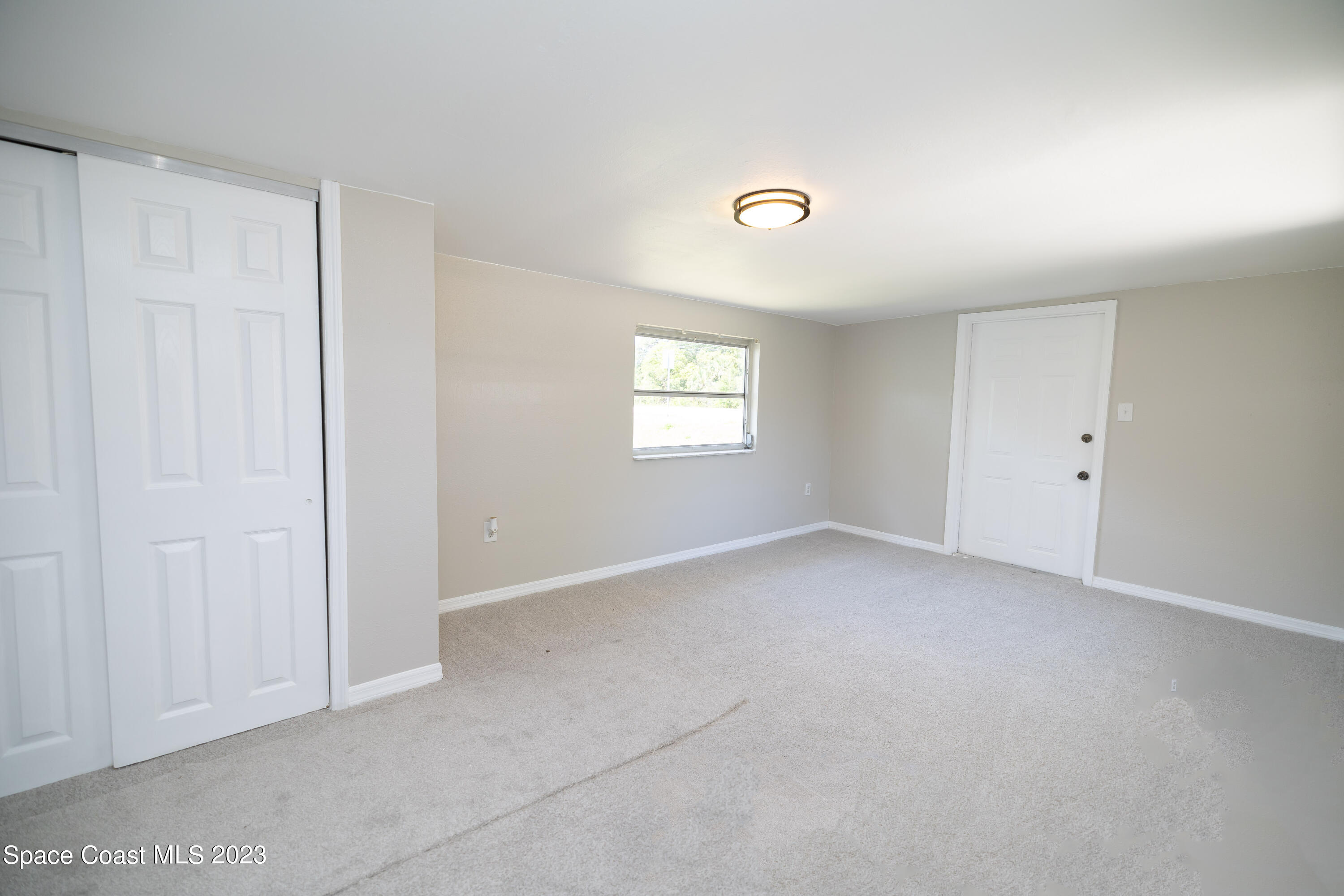 2411 Dairy Road Melbourne, FL 32901 - Photo 21 of 25 an empty room with windows