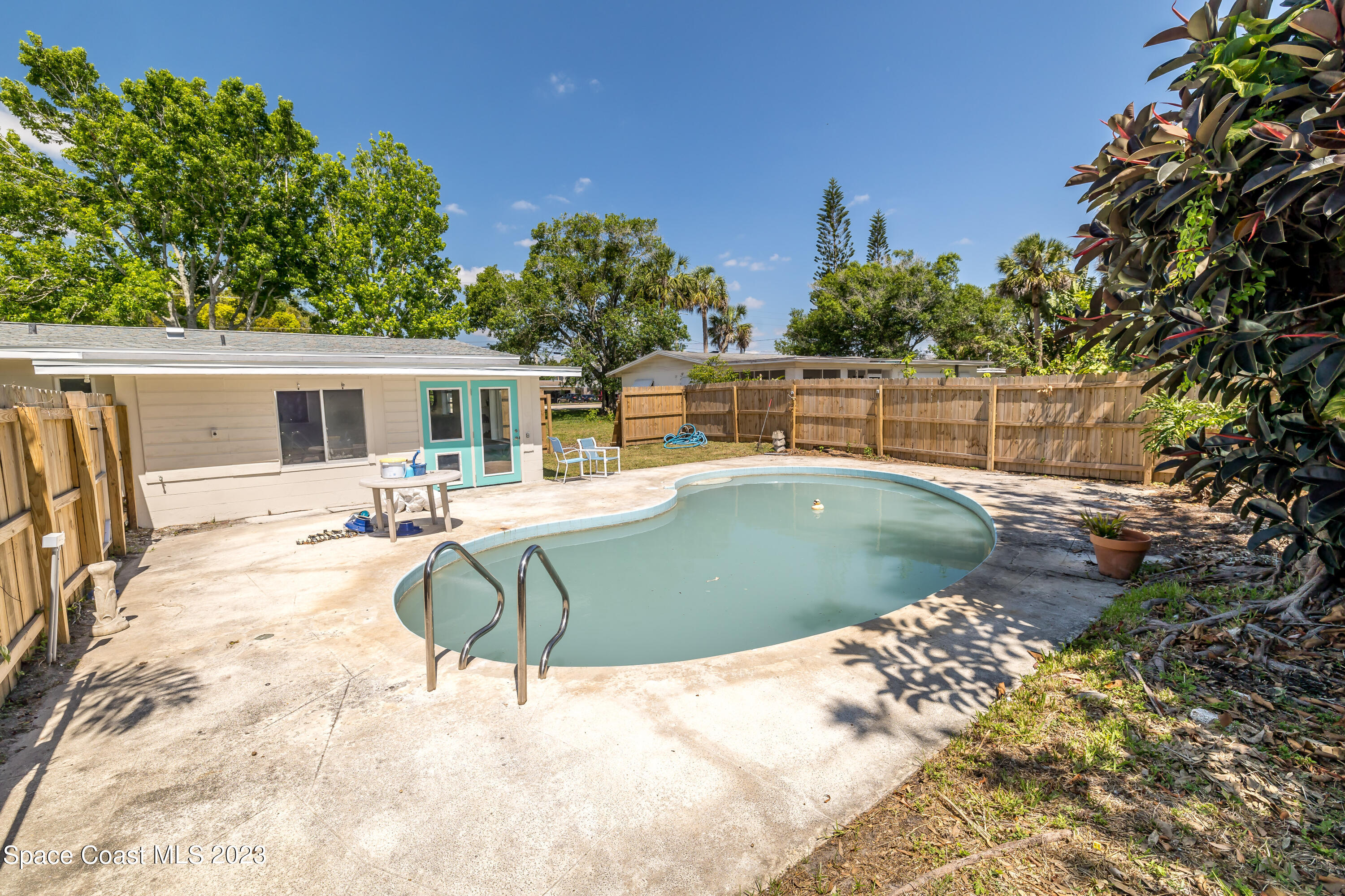 2411 Dairy Road Melbourne, FL 32901 - Photo 22 of 25 a view of a swimming pool with a patio