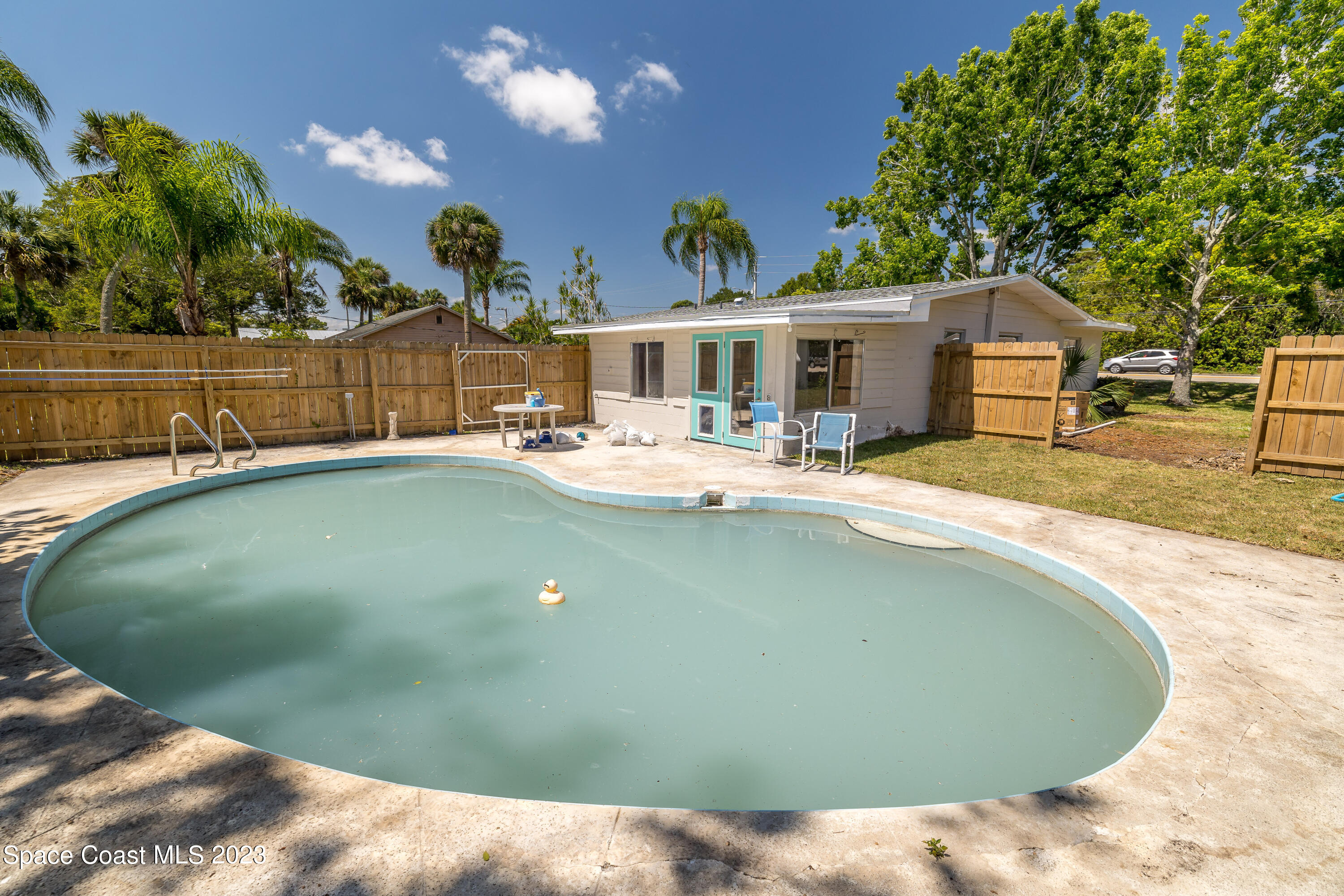 2411 Dairy Road Melbourne, FL 32901 - Photo 4 of 25 a view of a house with swimming pool