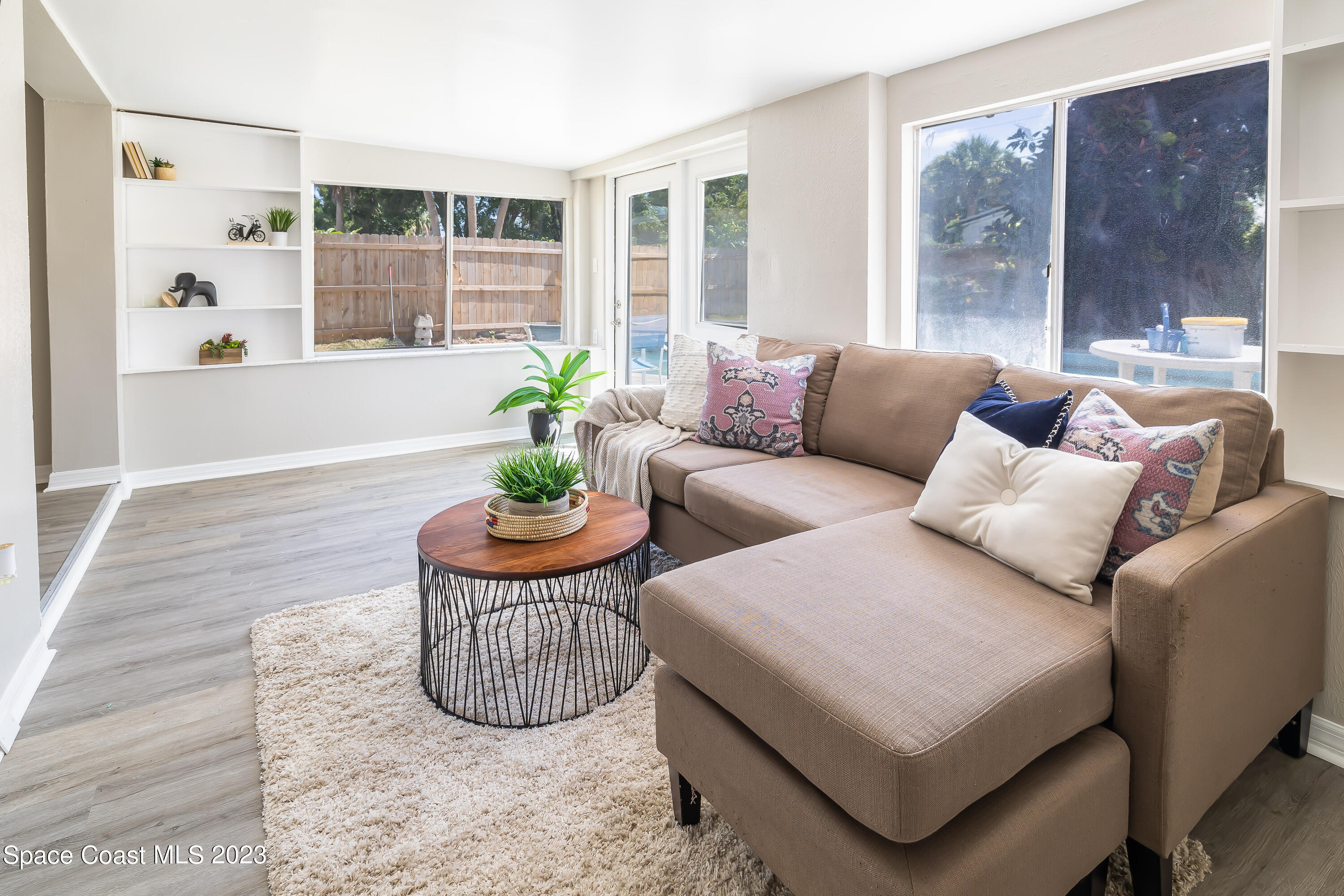 2411 Dairy Road Melbourne, FL 32901 - Photo 7 of 25 a living room with furniture and a potted plant