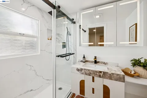 a view of a patio with a dining table and chairs