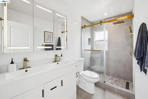 a living room with furniture a fireplace and a large window