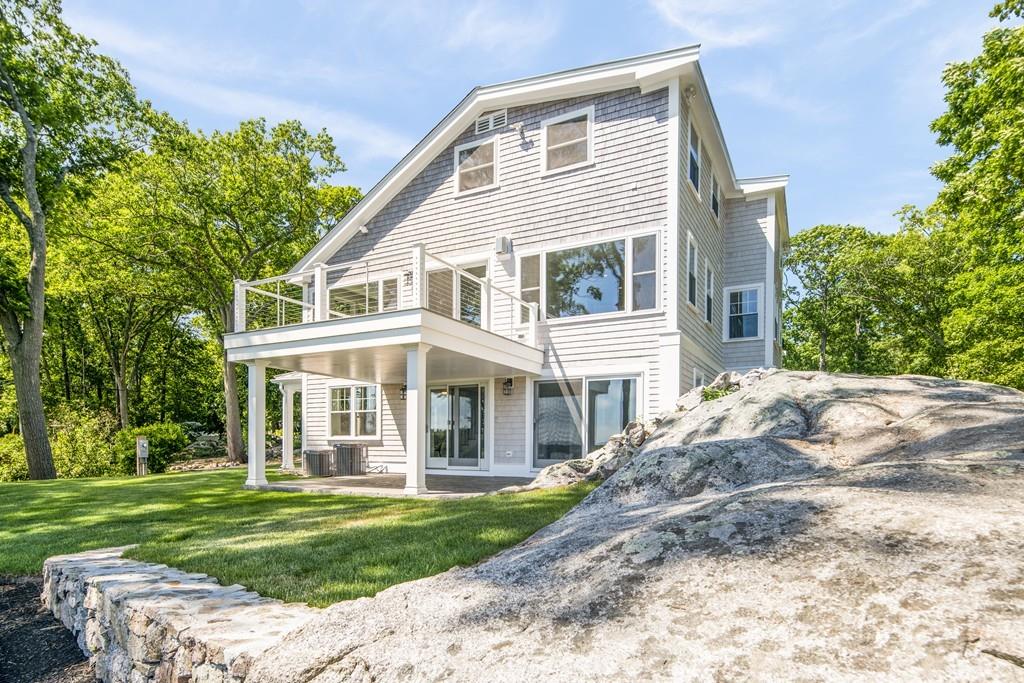 52 Elmore Road Hingham, MA 02043 - Photo 11 of 39 a front view of a house with a yard