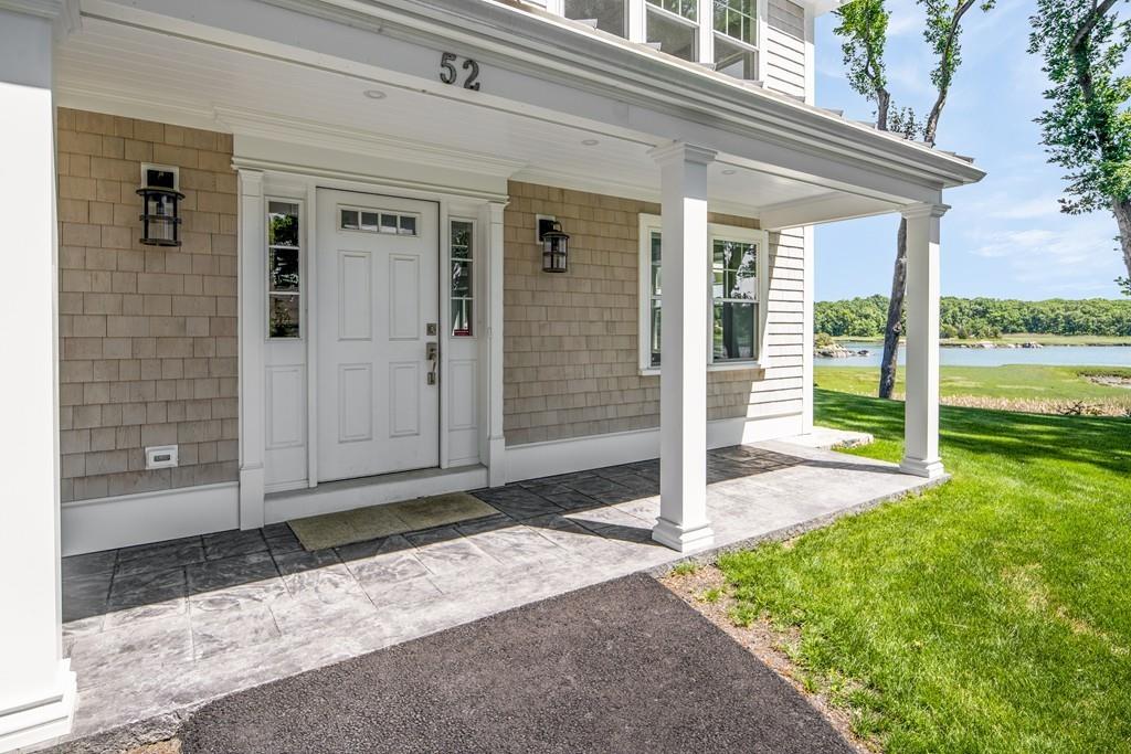 52 Elmore Road Hingham, MA 02043 - Photo 14 of 39 a front view of a house with a porch