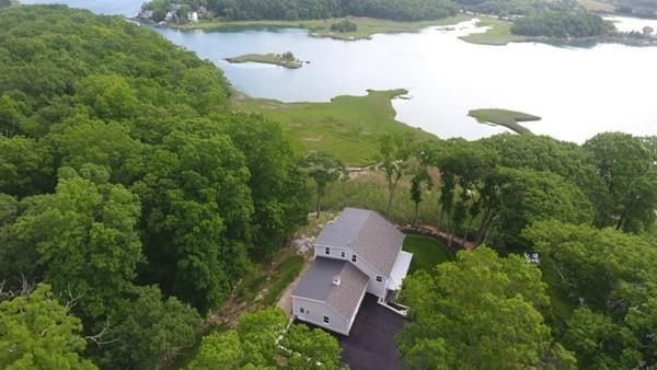 52 Elmore Road Hingham, MA 02043 - Photo 2 of 39 an aerial view of a house with yard and outdoor seating