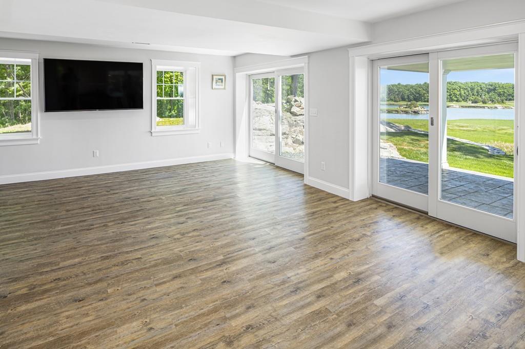 52 Elmore Road Hingham, MA 02043 - Photo 30 of 39 a view of an empty room with wooden floor and a window