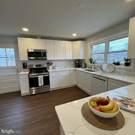 a kitchen with sink cabinets and outdoor view
