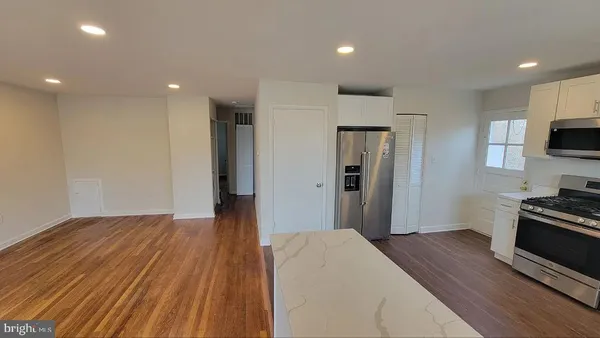 a bedroom with a bed and a television