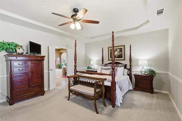 a bed room with a bed and a television