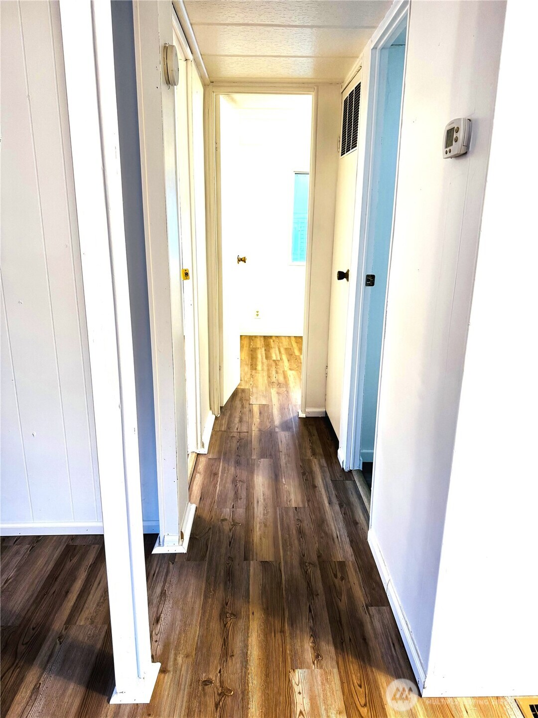 63 Onyx Street Walla Walla, WA 99362 - Photo 12 of 16 a view of a hallway with wooden floor and staircase