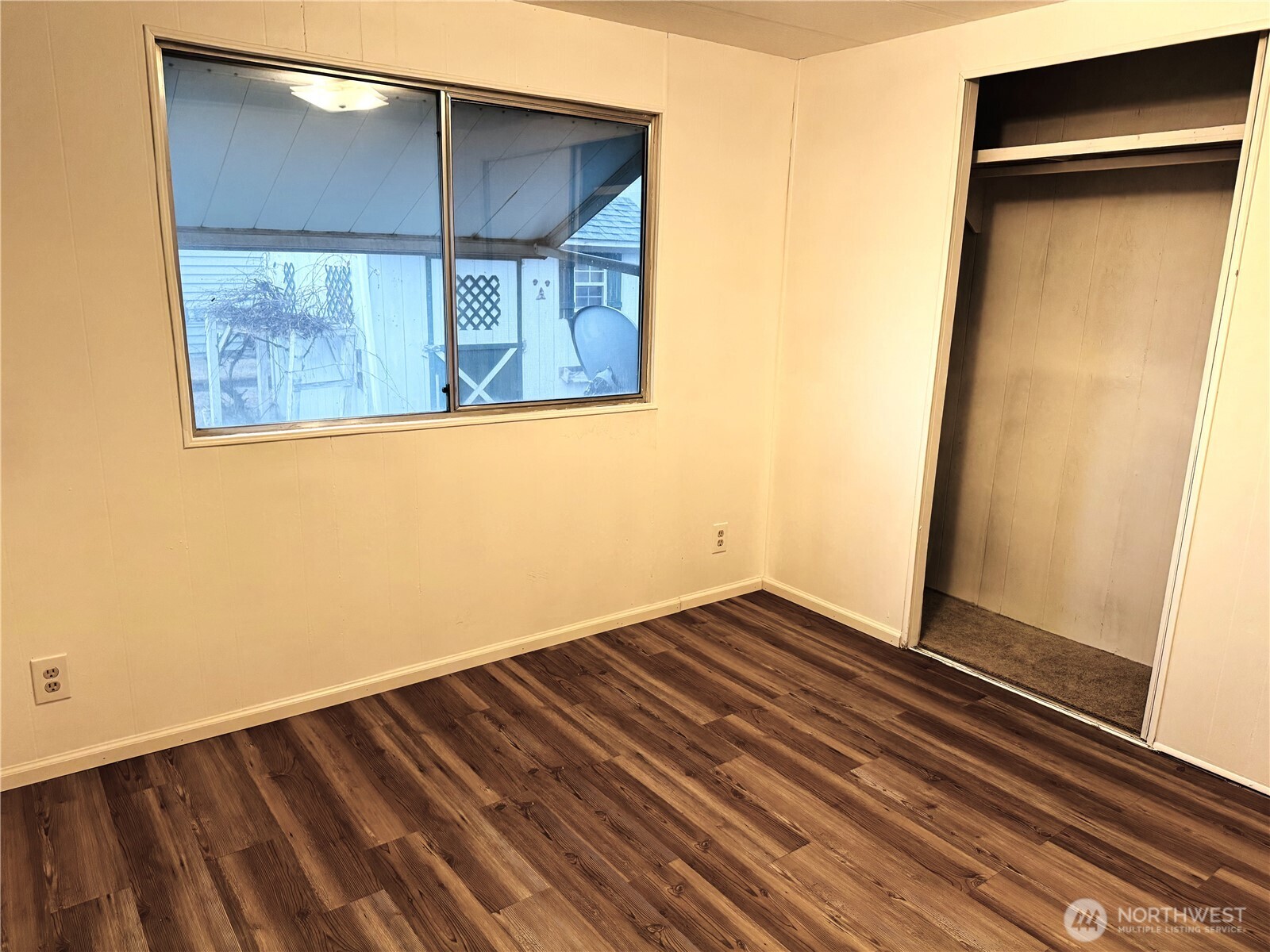 63 Onyx Street Walla Walla, WA 99362 - Photo 14 of 16 an empty room with wooden floor and windows