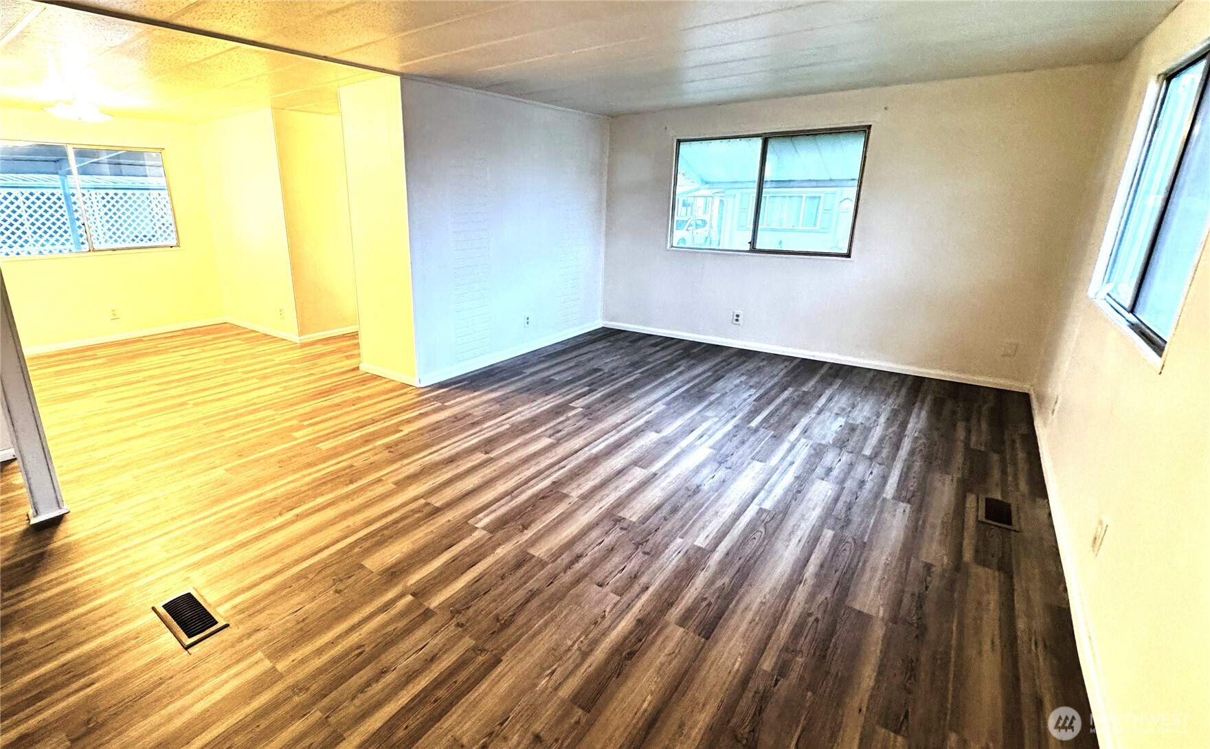 63 Onyx Street Walla Walla, WA 99362 - Photo 7 of 16 a view of an empty room with wooden floor and a window