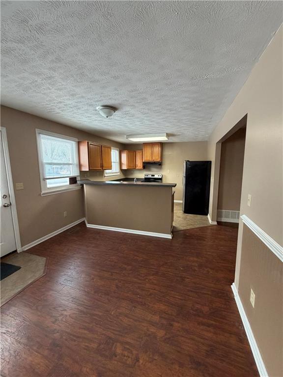 3586 North Hermitage Road Transfer, PA 16154 - Photo 4 of 14 a view of a livingroom with wooden floor and a kitchen