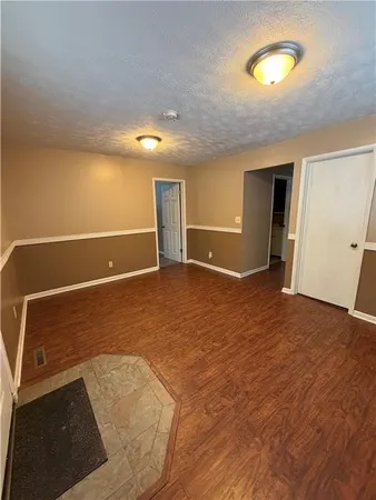 a view of room with window and pillar