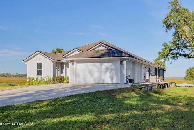 a front view of a house with a yard and porch