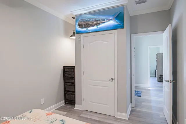 a view of a patio with chairs and umbrellas on a deck