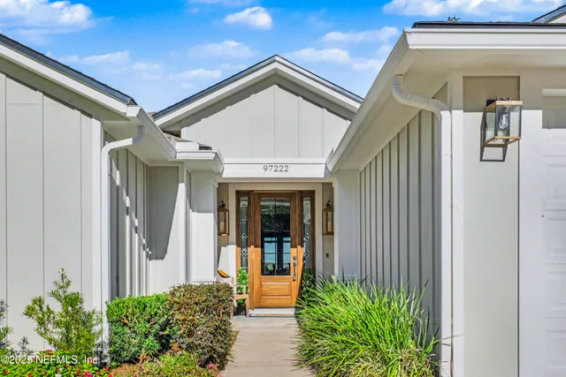 a view of entryway with wooden floor and cabinet