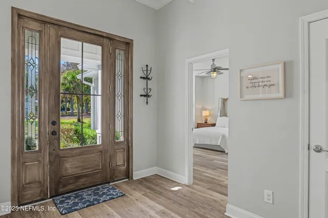 a living room with furniture a rug and a flat screen tv