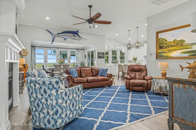 a living room with fireplace furniture and a wooden floor