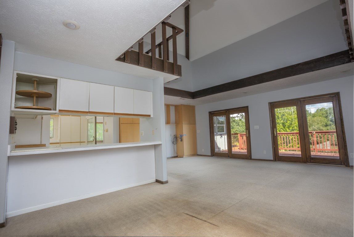 14852 Hauley Road Durand, IL 61024 - Photo 14 of 40 a view of an empty room with a window and fireplace