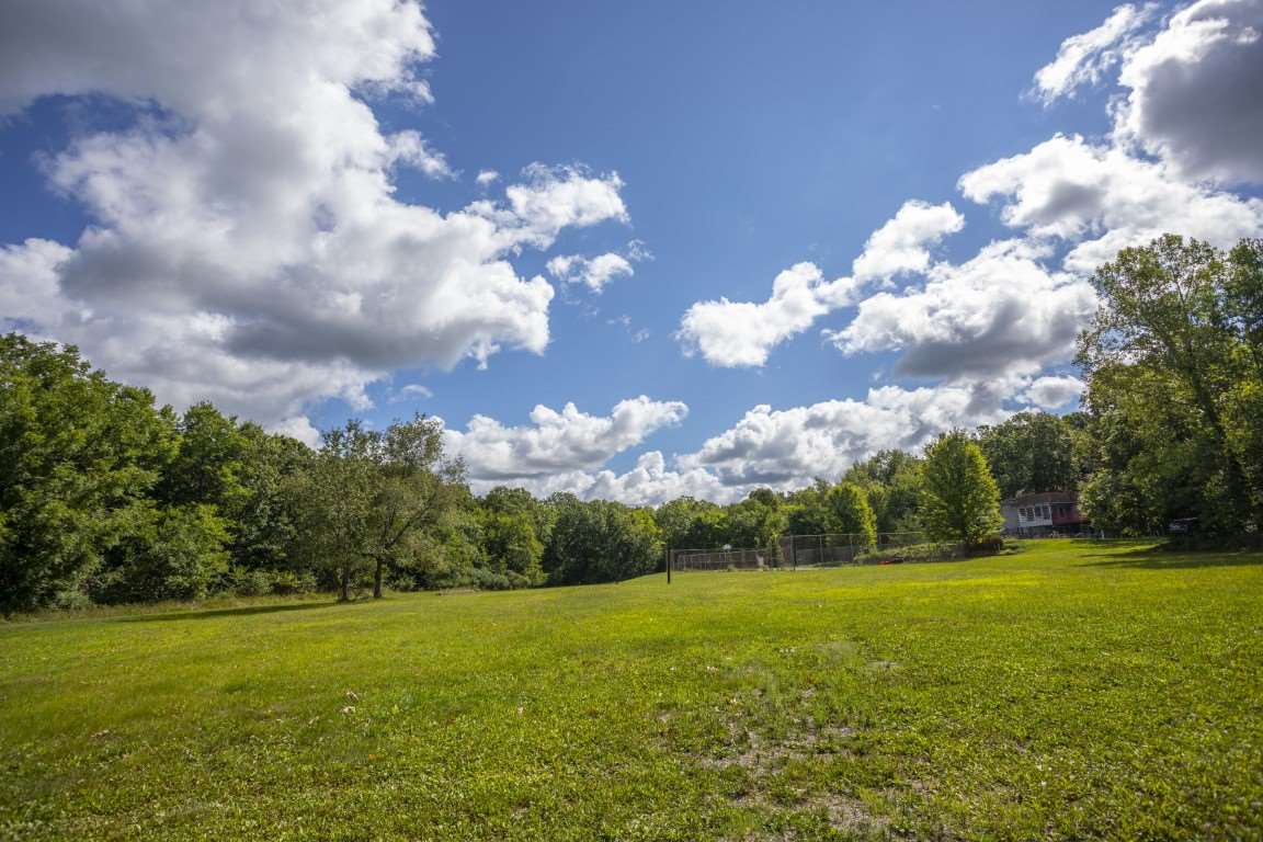 14852 Hauley Road Durand, IL 61024 - Photo 8 of 40 a view of a big yard with large trees