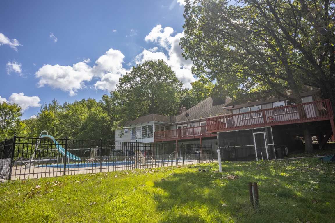 14852 Hauley Road Durand, IL 61024 - Photo 10 of 40 a view of a house with a backyard porch and sitting area