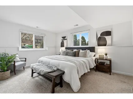 a bedroom with a bed and window