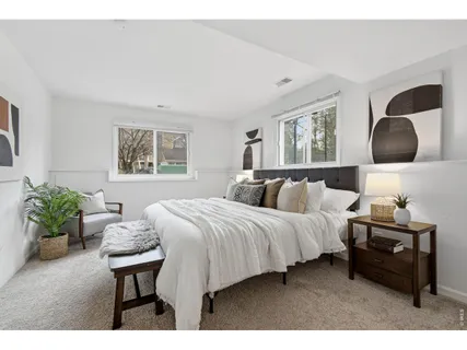a bedroom with a bed and window