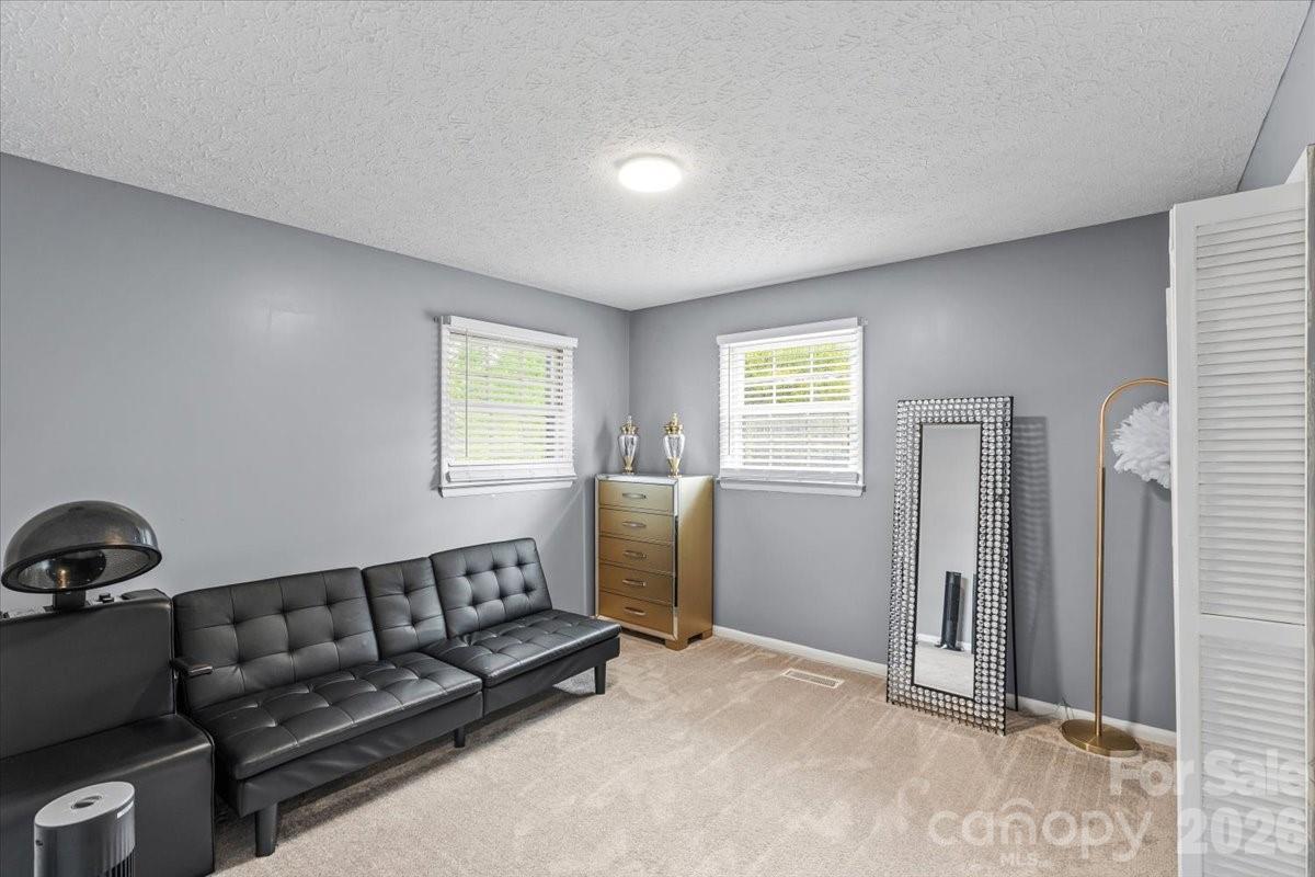 1527 Rhyne Street Shelby, NC 28152 - Photo 13 of 30 a living room with furniture and a window