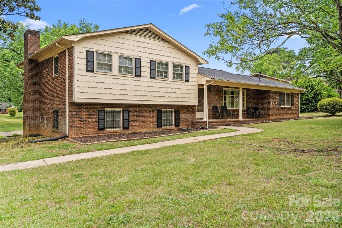 1527 Rhyne Street Shelby, NC 28152 - Photo 2 of 30 a front view of a house with a yard and trees