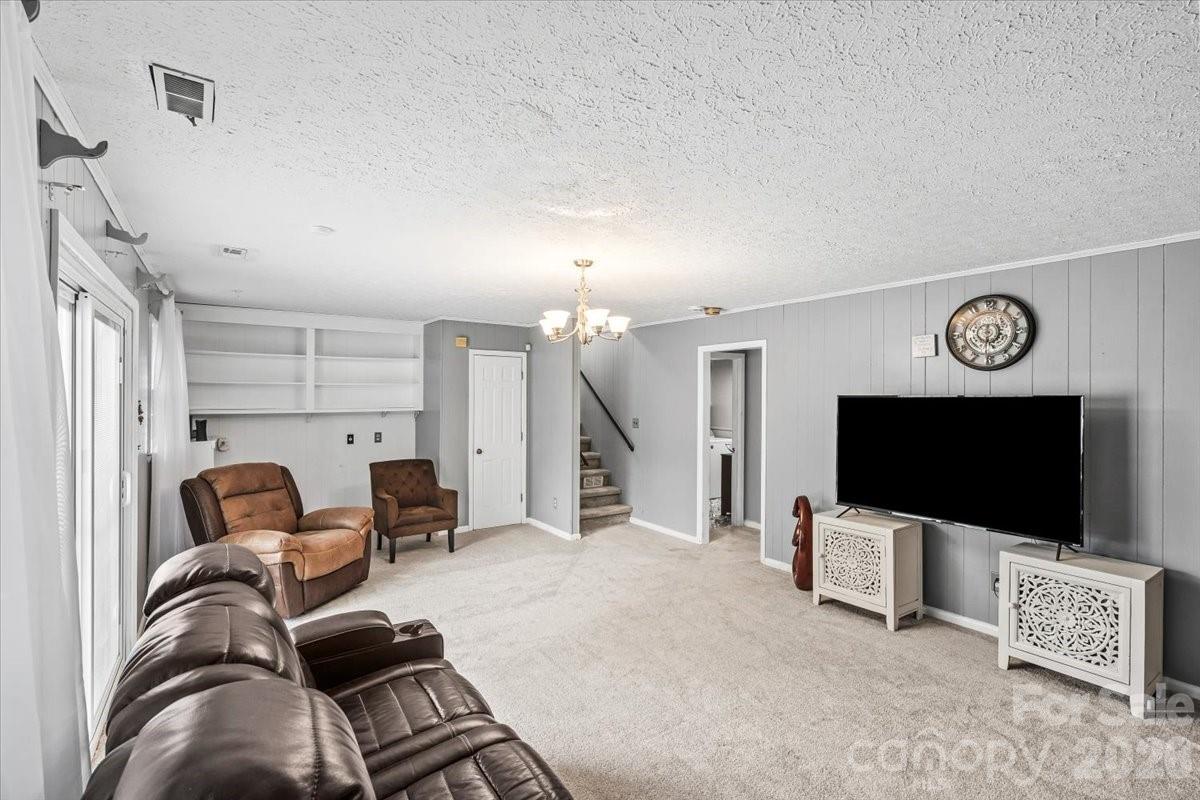 1527 Rhyne Street Shelby, NC 28152 - Photo 21 of 30 a living room with furniture and a flat screen tv