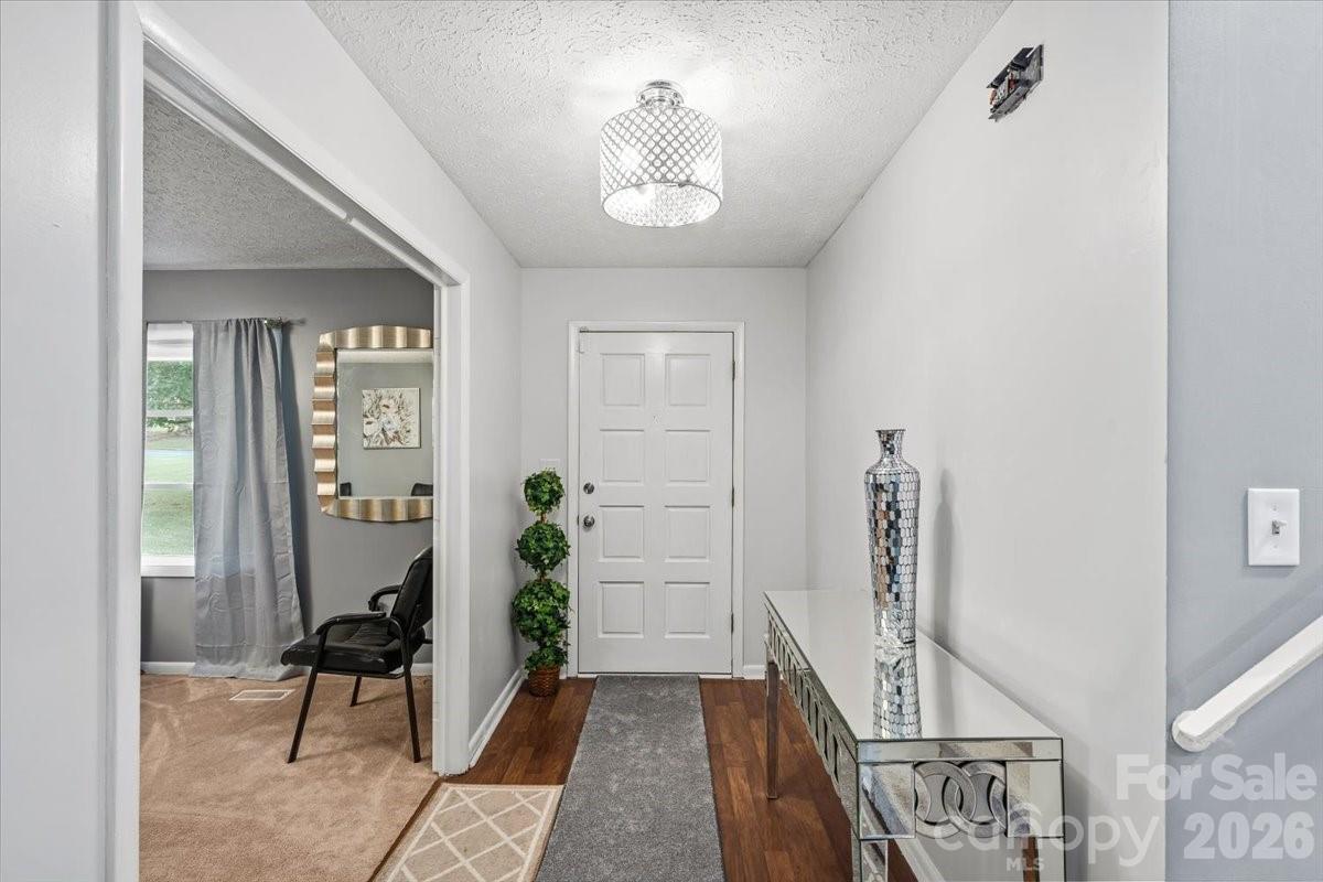 1527 Rhyne Street Shelby, NC 28152 - Photo 3 of 30 a view of an entryway with wooden floor