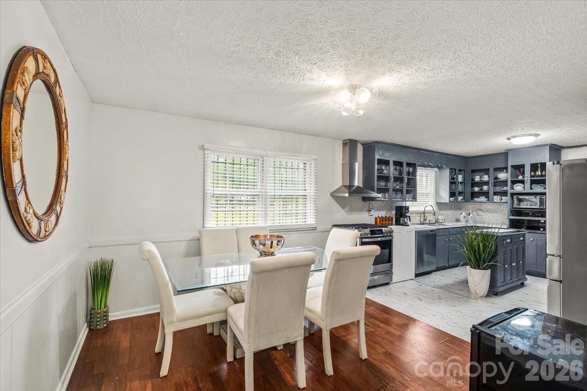 1527 Rhyne Street Shelby, NC 28152 - Photo 7 of 30 a dining room with furniture and a floor to ceiling window