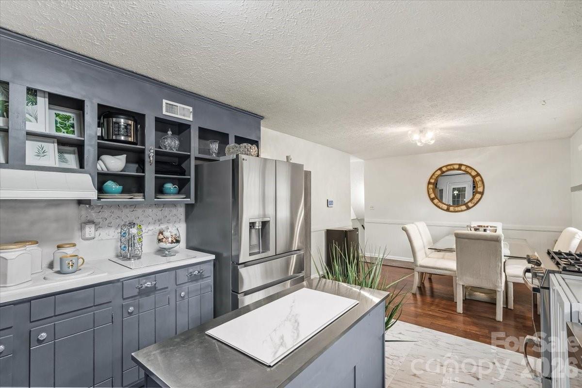 1527 Rhyne Street Shelby, NC 28152 - Photo 8 of 30 a kitchen with a table and chairs in it
