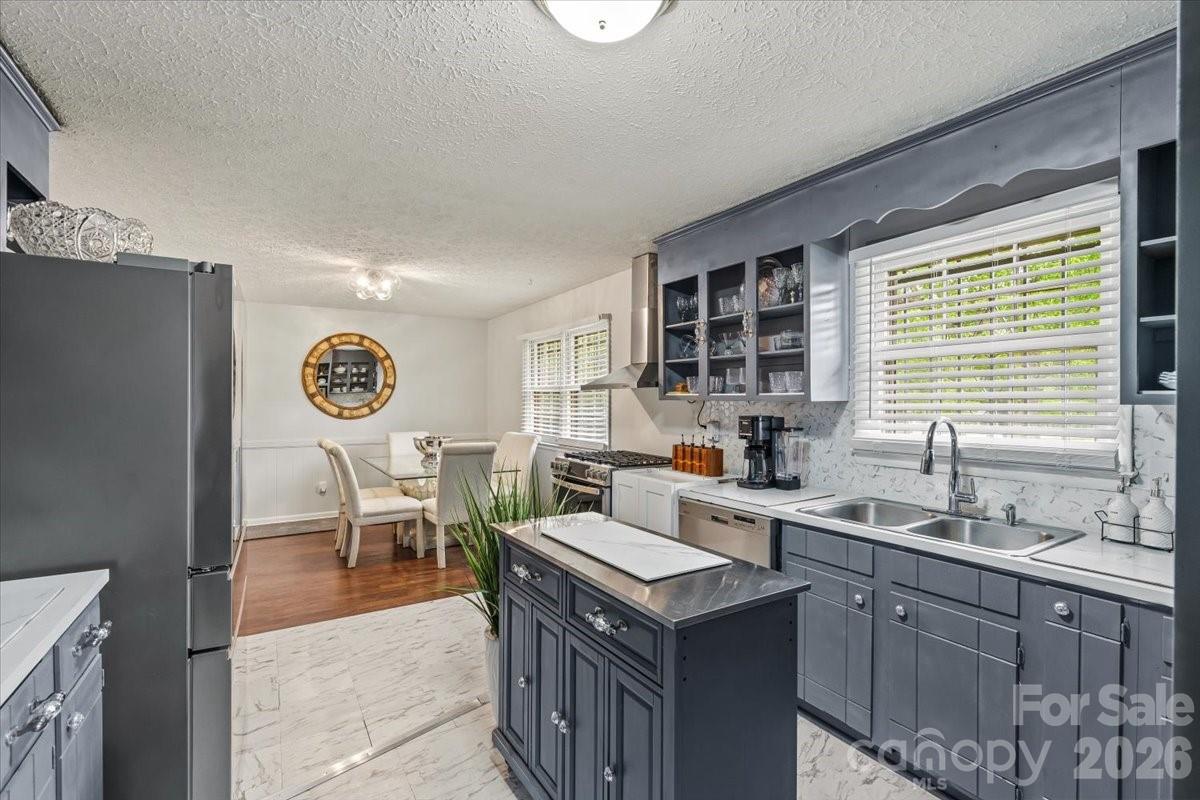 1527 Rhyne Street Shelby, NC 28152 - Photo 9 of 30 a kitchen with a sink cabinets and window