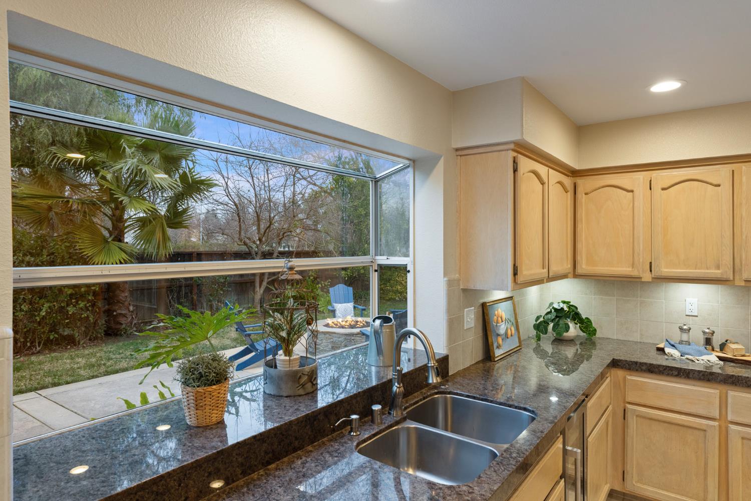 2309 O'Keeffe Pl. Davis, CA 95618 - Photo 12 of 57 a kitchen with a large window and sink