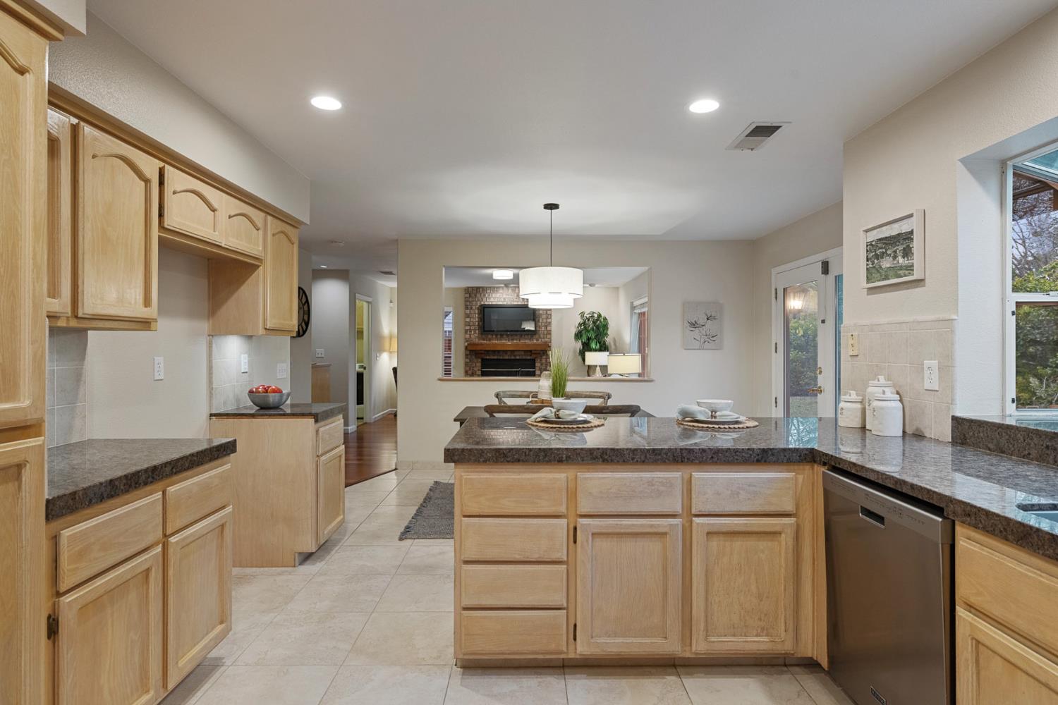 2309 O'Keeffe Pl. Davis, CA 95618 - Photo 15 of 57 a kitchen with sink cabinets and stove