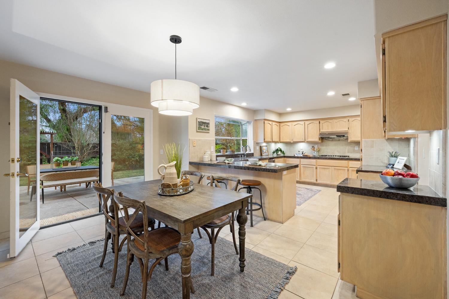 2309 O'Keeffe Pl. Davis, CA 95618 - Photo 17 of 57 a kitchen with a dining table and chairs