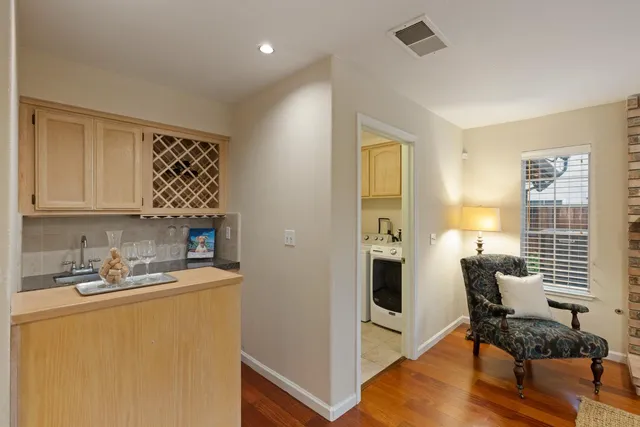a view of kitchen with cabinets and wooden floor