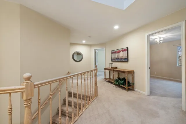 a bedroom with a bed and a large window with outer view