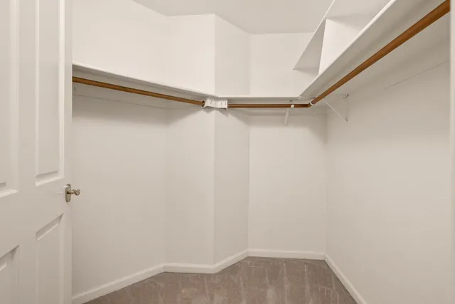 a bathroom with a double vanity sink mirror and bathtub