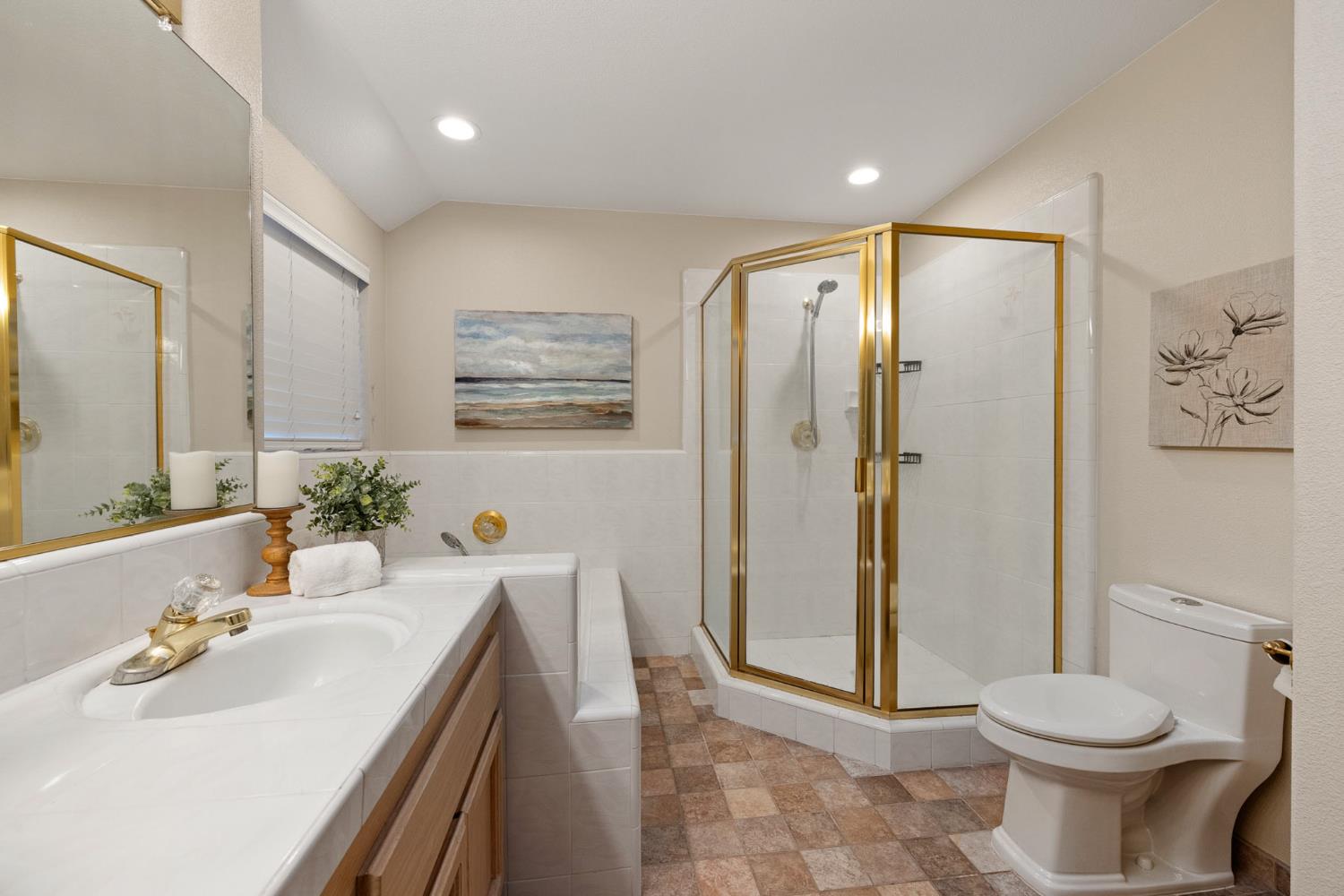 2309 O'Keeffe Pl. Davis, CA 95618 - Photo 28 of 57 a bathroom with a sink a toilet and shower